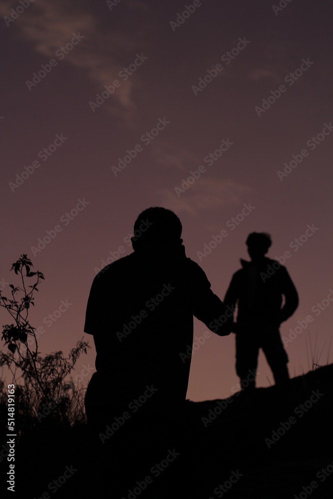 silhouette of photographer and model