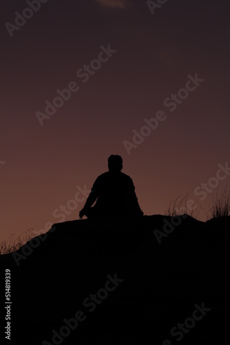 silhouette of a person at sunset