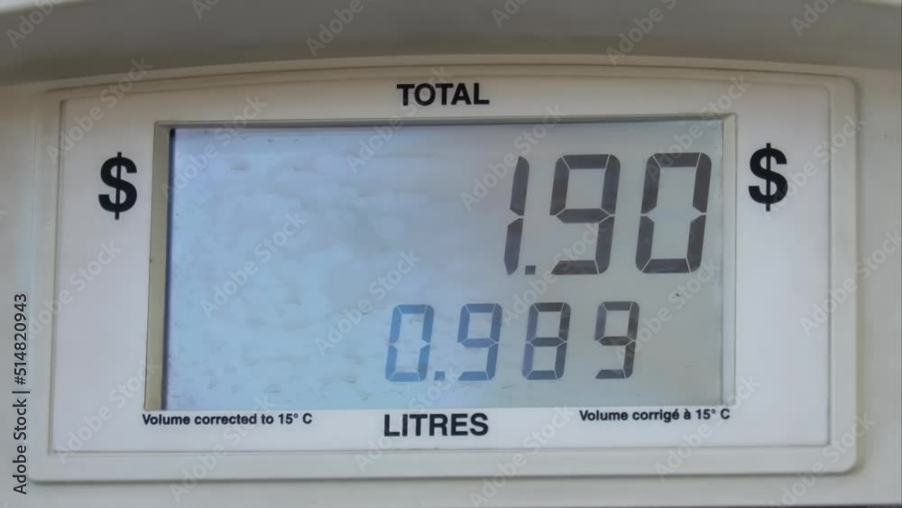 A close up to a gas station pump display showing litres and price. 