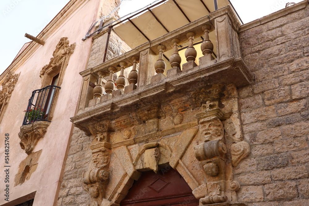 Erice, Sicily (Italy): detail of baroque ornamental  mascarons under the balcony 
