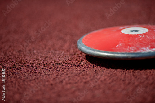 Professional discus on the track and field stade. Horizontal sport poster, greeting cards, headers, website.