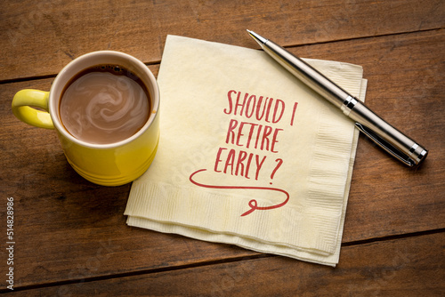 Should I retire early? Question handwritten on a napkin. Retirement planning concept. photo