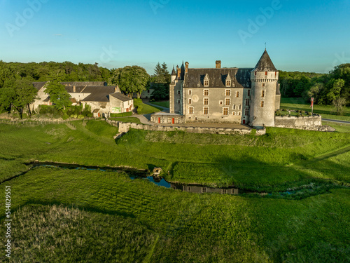 Evening sunset view of Montpoupon castle in the Loire valley with circular tower and palace building