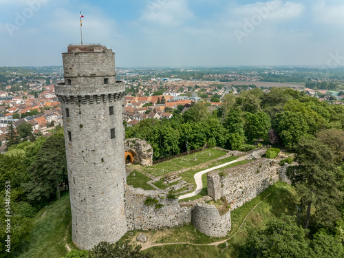 Aerial view of medieval ruined Montlhéry castle controlling the Paris - Orleans road with prominent keep towering over the hill in Central France photo