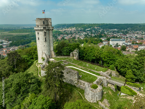 Aerial view of medieval ruined Montlhéry castle controlling the Paris - Orleans road with prominent keep towering over the hill in Central France photo