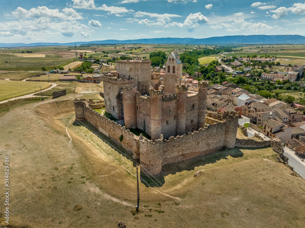 Obraz premium Aerial view of Turégano a village and municipality of Spain in the province of Segovia, Castile and León. Medieval feudal castle with donjon, circular towers integrating church of San Miguel