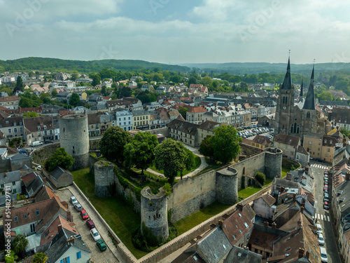 Aerial view of Dourdan castle characteristic of military architecture of medieval period. It is built on a square pattern, with towers at three of the corners and an isolated donjon at the fourth.  photo