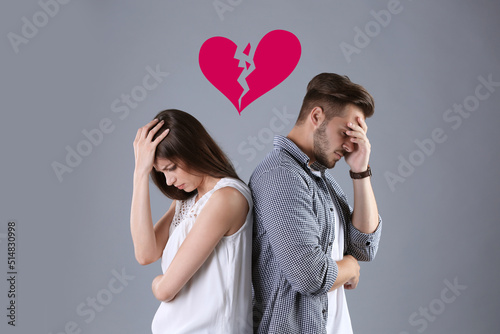Canvas Print Upset young couple and illustration of broken heart on grey background