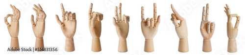 Set with wooden hands of mannequins showing different gestures on white background. Banner design photo
