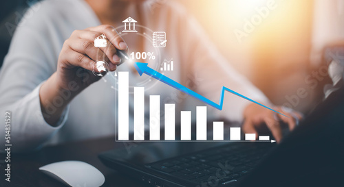Business finance technology and investment concept. Stock Market Investments Funds and Digital Assets. Woman using laptop or computer and trading graph financial data. Business finance background.