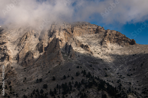 Landscape of the  Olympus Range mountains. View of a high rocky peaks and deep gorges. The highest peak, Mytikas. It is highest mountains in Greece. National Park. World Biosphere Reserve. Europe. photo