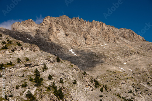 Landscape of the  Olympus Range mountains. View of a high rocky peaks and deep gorges. The highest peak, Mytikas. It is highest mountains in Greece. National Park. World Biosphere Reserve. Europe. photo