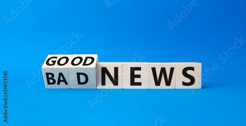 Good news and Bad news symbol. Turned wooden cubes with words Good news and Bad news. Beautiful blue background. Business concept. Copy space