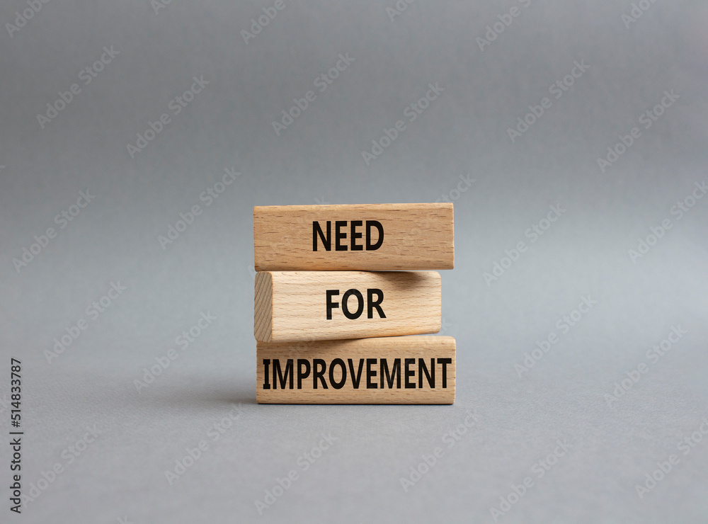 Need for Improvement symbol. Wooden blocks with words Need for Improvement. Beautiful grey background. Business and Need for Improvement concept. Copy space.