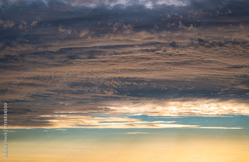 Detailed image of a textured pastel colored sky in the golden hour before sunset