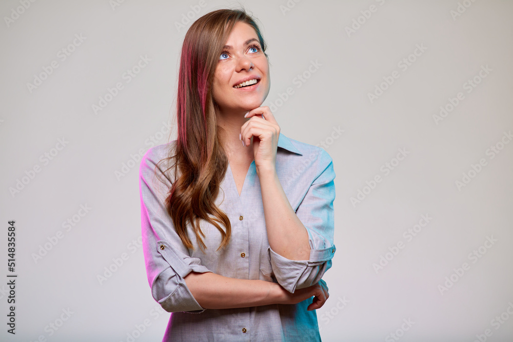 Thinking smiling business woman looking up, isolated portrait. Photo with colored filter. Thinking smiling business woman looking up, isolated portrait. Photo with colored filter.