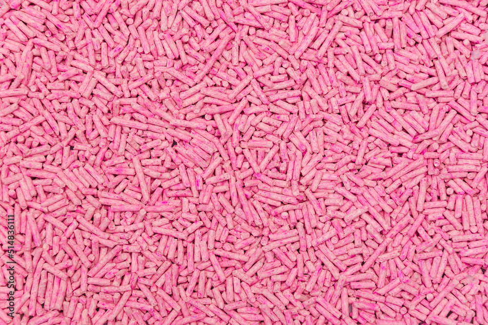 Pink soy pellets for texture or background. Cat litter product from tofu - soy bean. Natural pink tofu pellets. A natural organic substance biodegradable and good for environment.