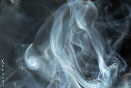 photo of drifting smoke in the dark, background.