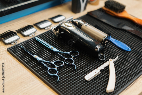 Barbershop, close-up: haircut equipment, scissors and razors photo