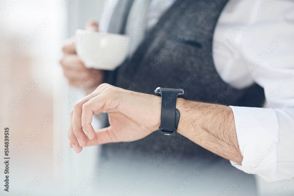 Close-up of unrecognizable businessman drinking coffee and using smart watch to see notifications Close-up of unrecognizable businessman drinking coffee and using smart watch to see notifications