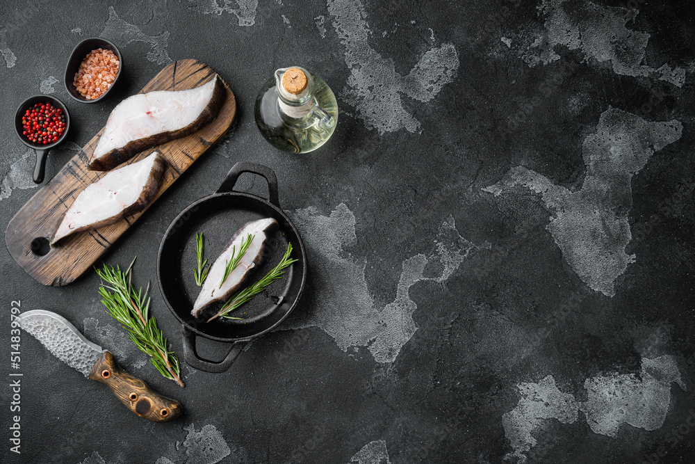 Piece of fresh raw halibut fish, with ingredients and rosemary herbs