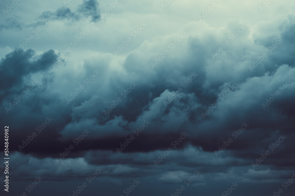 Obraz premium Storm sky with dark grey cumulus clouds. Thunderstorm