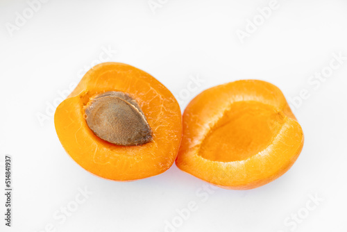 Fresh whole and sliced apricot. Isolated. White background