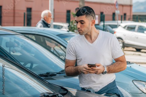 man buying used or second-hand car at dealership