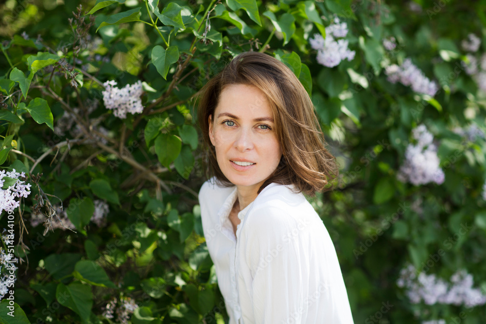 middle aged woman relaxed outdoors. copy space. Slow life. Enjoying the little things. spends time in nature in summer middle aged woman relaxed outdoors. copy space. Slow life. Enjoying the little things. spends time in nature in summer