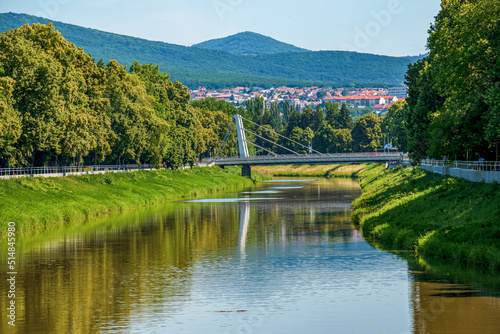 View of the Slovak city of Nitra. View of the Nitra River  a modern bridge and characteristic red European