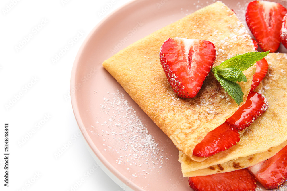 Plate of thin pancakes with strawberries and mint leaves on white background, closeup Plate of thin pancakes with strawberries and mint leaves on white background, closeup