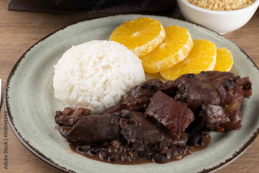 Focus on delicious Brazilian feijoada on plate. Focus on delicious Brazilian feijoada on plate.