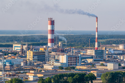 aerial view on pipes of chemical enterprise plant. Air pollution concept. Industrial landscape environmental pollution waste of thermal power plant
