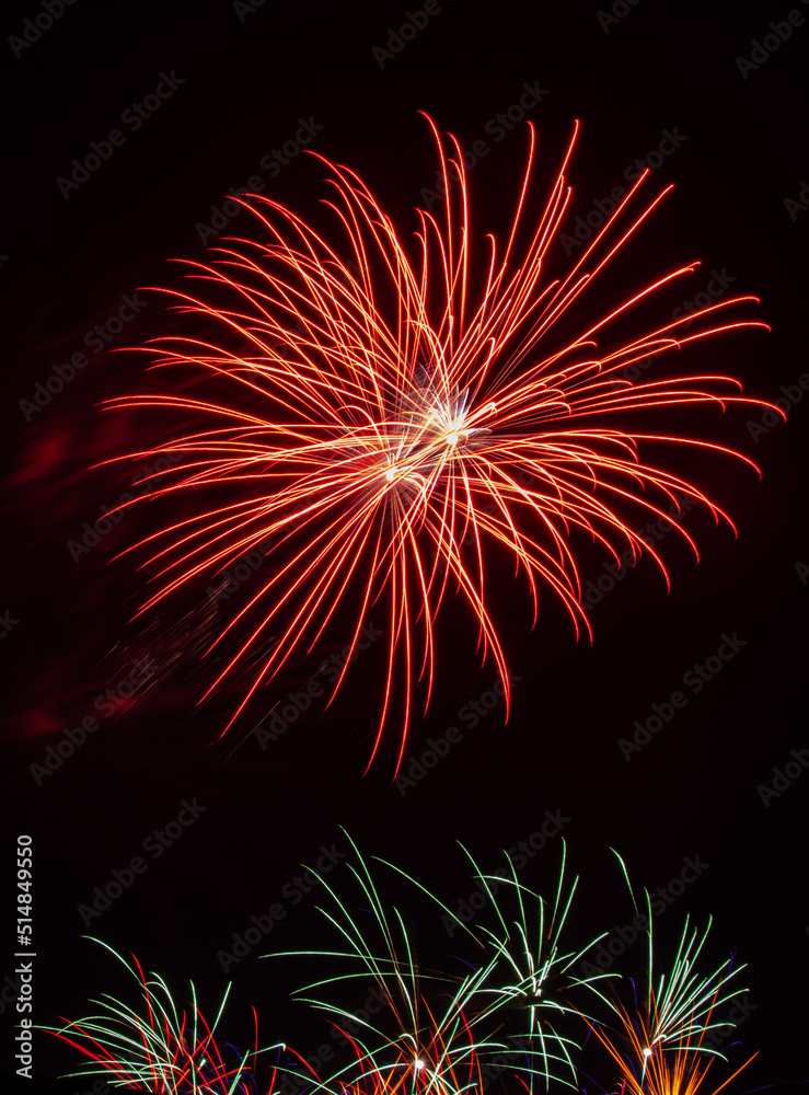 Playing with fireworks in the night sky Playing with fireworks in the night sky