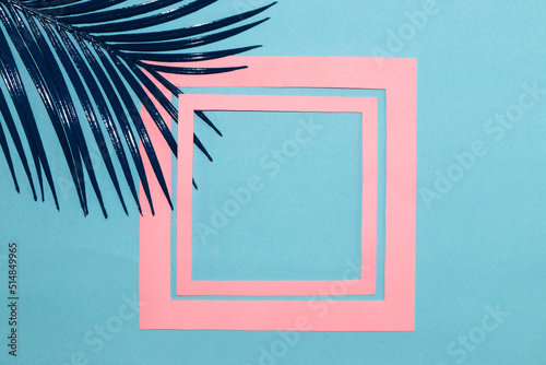 art tropical background, pastel blue background with blue palm leaf and pink frame in frame, creativity, copy space, product space