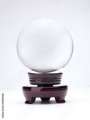 Crystal Ball on a stand isolated on white background photo