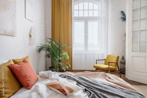 Photography Bright bedroom with interior design in the style of the boho chic