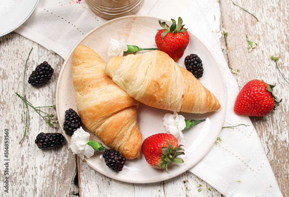breakfast with croissant and berries breakfast with croissant and berries