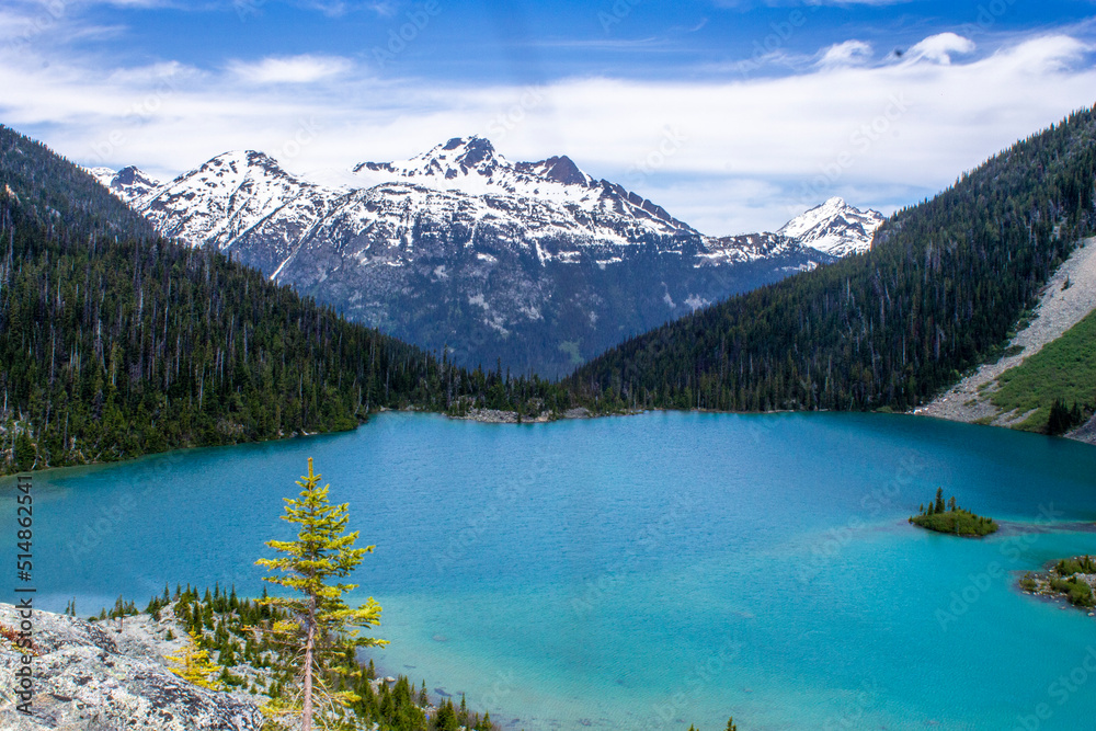 Lake with blue water and snowy mountains on the background in Joffre Lakes, BC, Canada