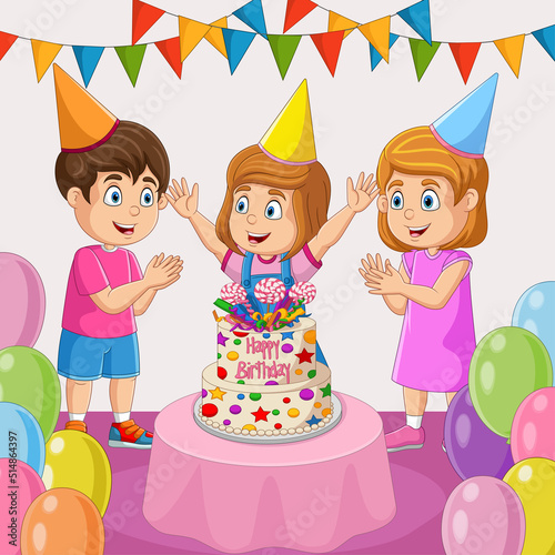 Happy girl with cake and her friends on birthday party