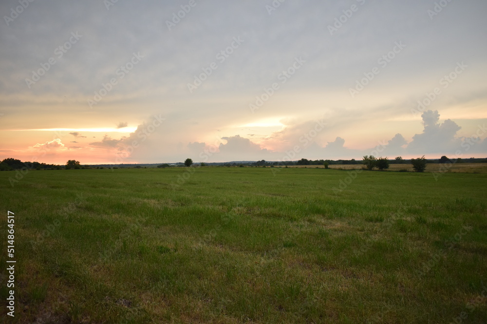 Clouds in a Sunset Over a Rural Field