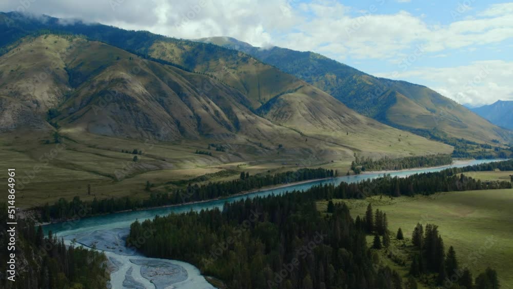 Blue Katun river in the middle of mountains of Ak-Kem valley in Altai, Siberia, Russia. Beautiful autumn nature landscape at during daytime. Aerial view from a drone Blue Katun river in the middle of mountains of Ak-Kem valley in Altai, Siberia, Russia. Beautiful autumn nature landscape at during daytime. Aerial view from a drone