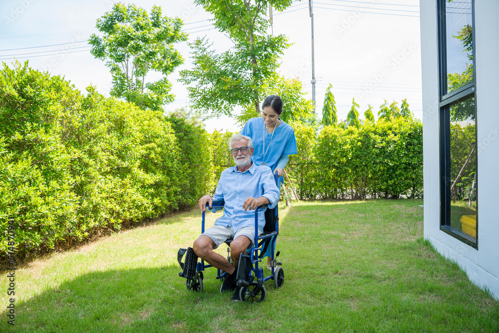 Happy nurse take care elderly man on wheelchair at nursing home,Nurse assisting senior age. Happy nurse take care elderly man on wheelchair at nursing home,Nurse assisting senior age.