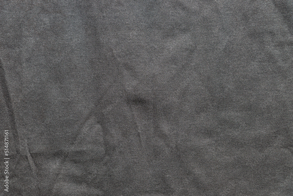 Crumpled texture of black textile clothing background Crumpled texture of black textile clothing background