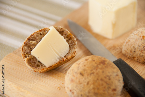 Sliced brazilian cheese bread with butter. (Pao de Queijo Integral - Brazilian food)