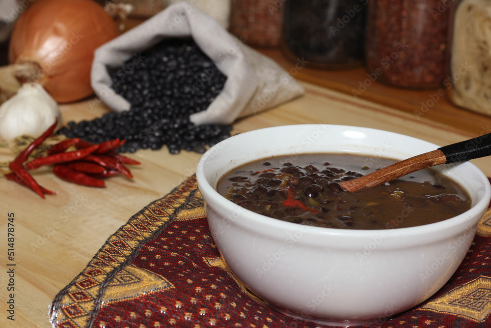 Black Bean Chili on Wooden Table With Spices and Dried Black Beans Black Bean Chili on Wooden Table With Spices and Dried Black Beans