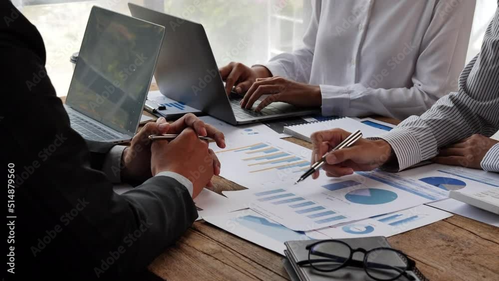 Business team analyzing income charts and graphs with modern laptop computer. Close up.Business analysis and strategy concept.