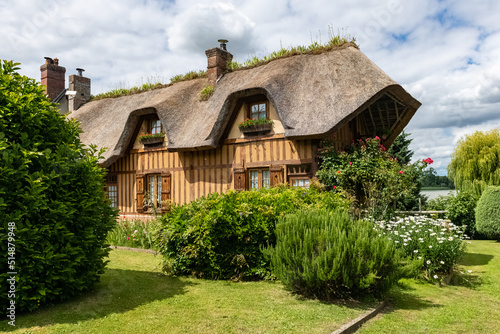 A thatched cottage in Normandy, on the banks of the Seine, beautiful house
