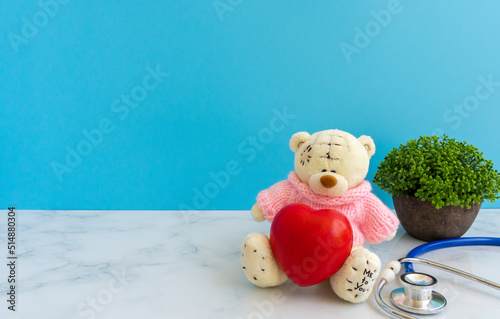 Children doctor concept - Teddy Bear with stethoscope. copy space