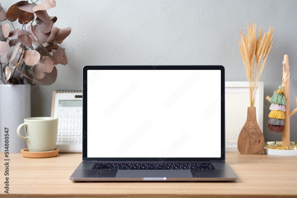 Obraz na plátně Blank screen laptop on working desk decor with stationery at home